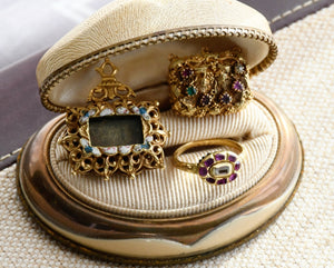 From Left to Right: the 17th century Spanish Reliquary Pendant, the 17th century ruby table cut diamond ring and Georgian Regency Regard Locket