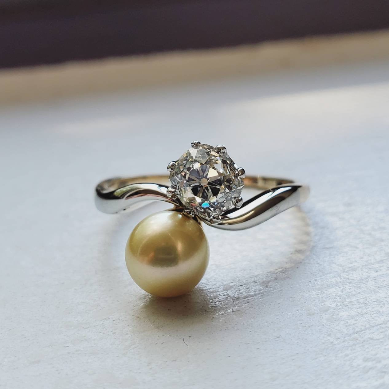 THE ANTIQUE PEARL AND DIAMOND TOI ET MOI RING